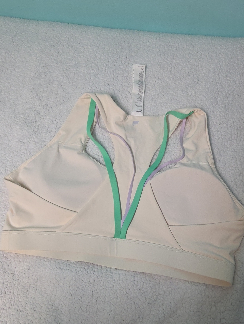 Fabletics Cream Racerback Sports Bra with Mint & Lavender Trim